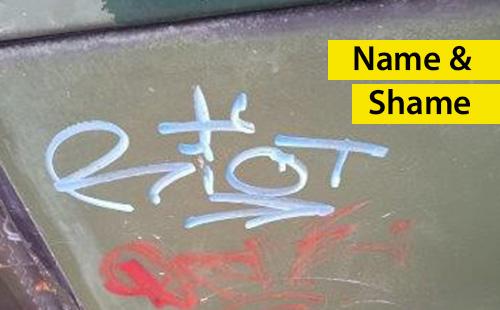 Image of graffiti with the word riot written